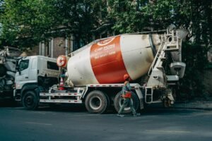 Concrete mixer truck parked on a busy street in Phnom Penh, Cambodia.