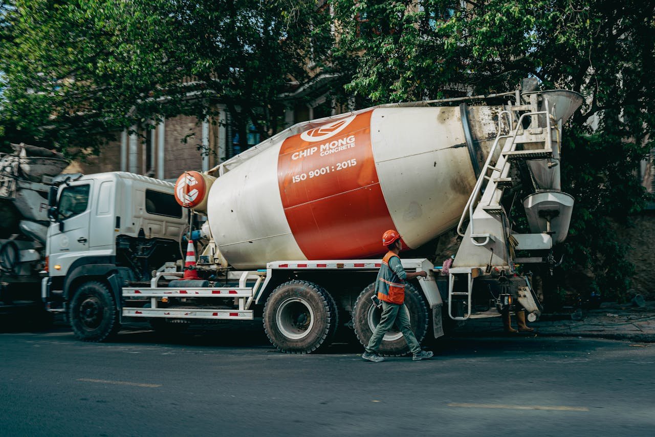 services-03 Concrete mixer truck parked on a busy street in Phnom Penh, Cambodia.